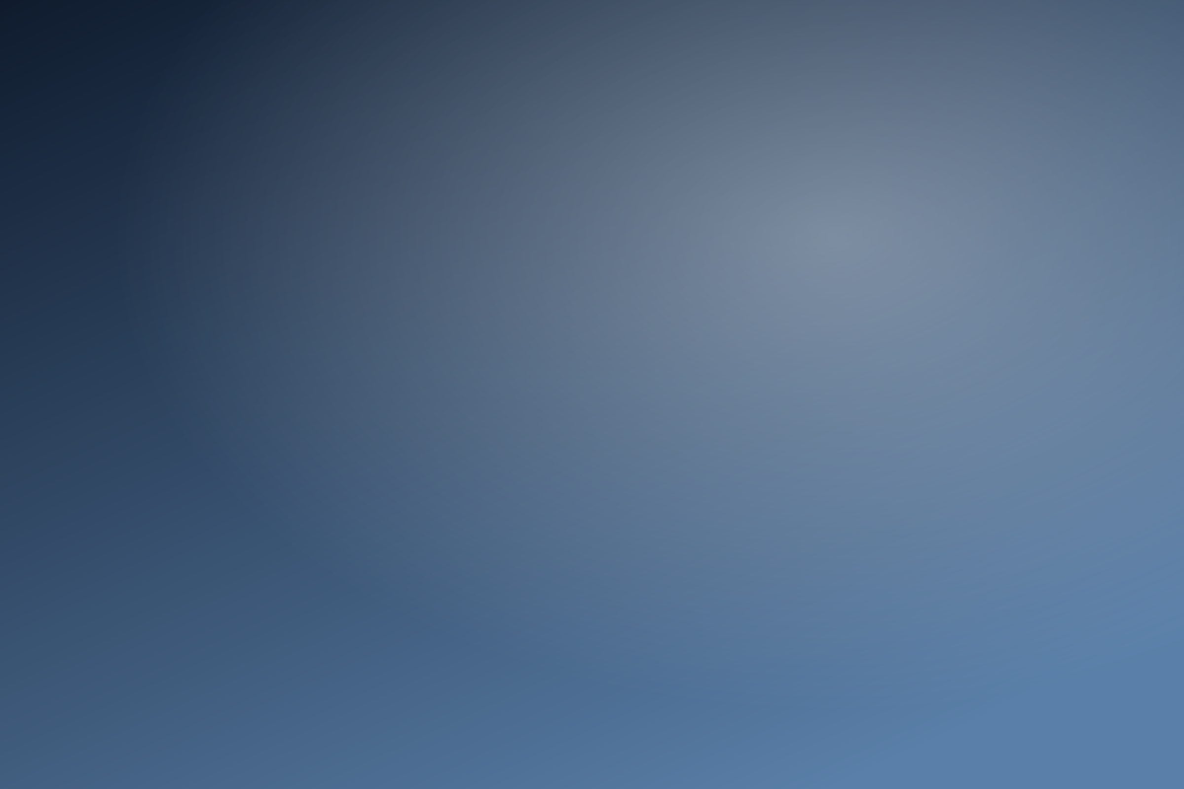 Placeholder gradient standing in for a city skyline at night